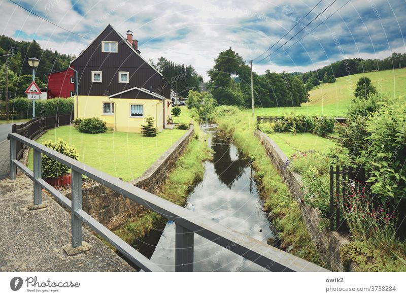 Close to nature Village Saxony houses Street Water reflection Reflection Handrail Sky windless Simple tranquillity Clouds Sunlight Idyll Village road cloudy