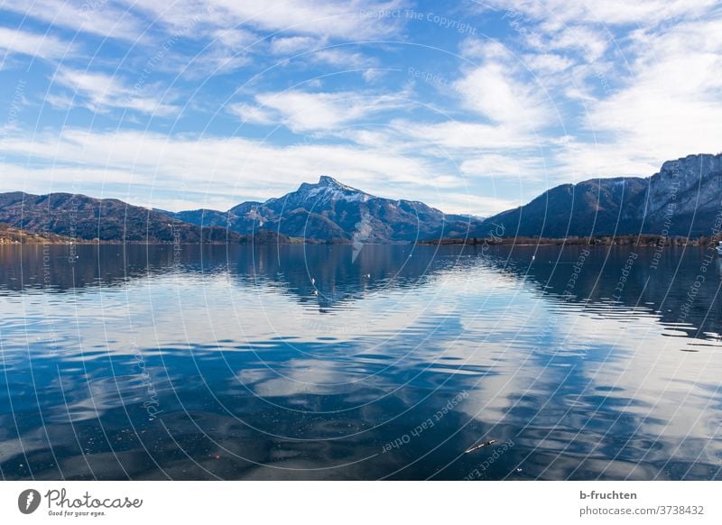 Lake with view of the mountains, Mondsee, Salzkammergut, Austria Mountain Clouds Sky Snow Alps Blue Vantage point Hiking moon lake Water Calm sheep's mountain