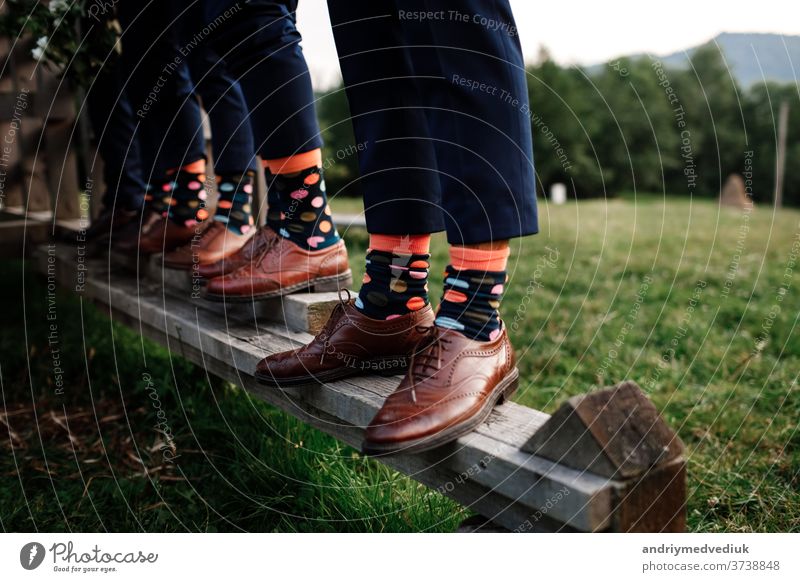 stylish men's socks. Stylish suitcase, men's legs, multicolored socks and new shoes. Concept of style, fashion, beauty and vacation mens socks luxury groom