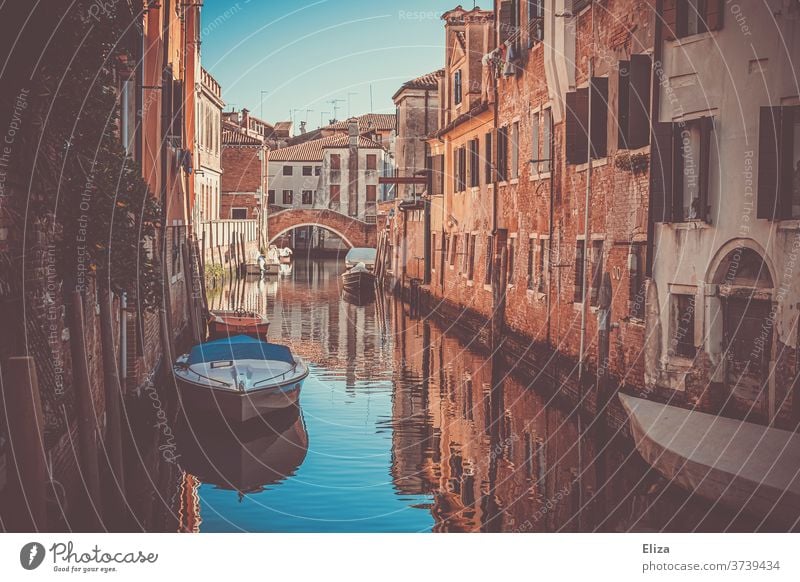 A small canal in Venice Channel Water Small atmospheric boats Italy Tourism Tourist Attraction Town Old town Narrow bridge houses romantic