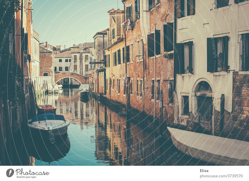 A small canal with boats in Venice Channel bridge houses Deserted Old town Italy Facade Water built Picturesque already Day Town reflection City trip