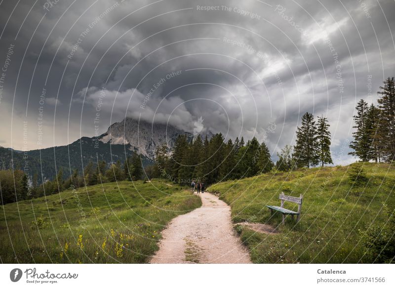 Dark storm clouds pile up above the Wetterstein, the hikers ignore the bank and follow their path Storm clouds Thunder and lightning Clouds Sky Weather Climate