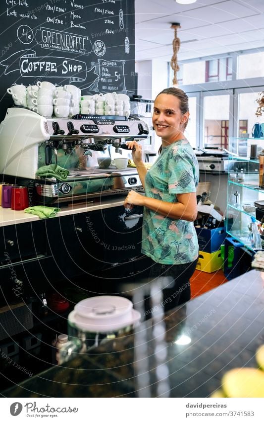 https://www.photocase.com/photos/3741583-female-barista-preparing-coffee-machine-woman-photocase-stock-photo-large.jpeg