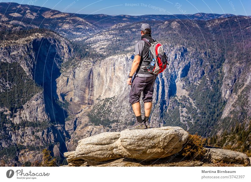 Backpacking in the Yosemite National Park, man enjoying the view hike yosemite backpacking viewpoint vacation caucasian glacier point yosemite valley landscape