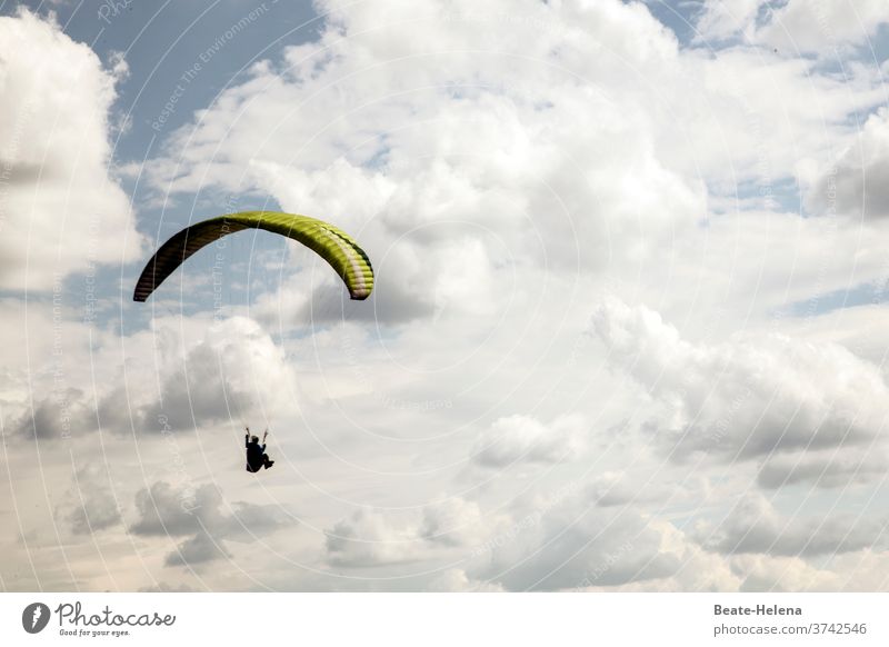 Paraglider in cloudy sky: lifted paraglide paragliding umbrella paraglider Flying Aviation Gliding Clouds Airfield Altitude flight hobby Air show Sky Aloof