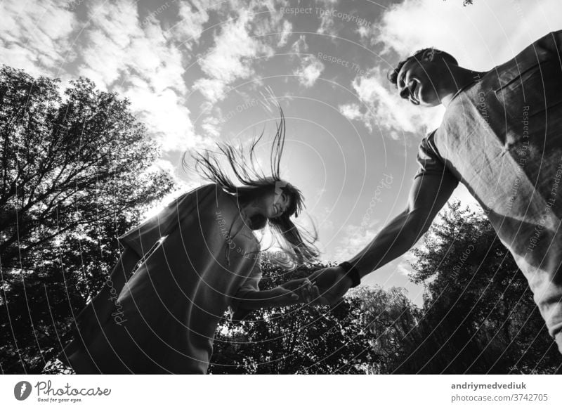 crazy young couple emotionally having fun, kissing and hugging outdoors. Love and tenderness, romance, family, emotions, fun. having fun together beach happy