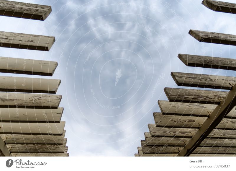 wooden planks on a background of sky and clouds abstract architecture backdrop blue board building cloudy color construction design detail geometry home house