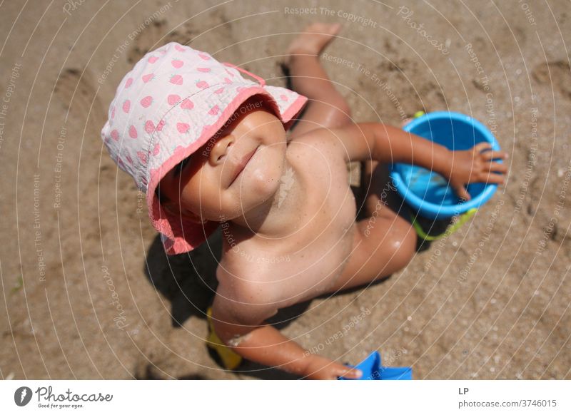 child at the beach playing in the sand looking at the camera Child Children's game Upper body Portrait photograph Abstract Experimental Close-up Exterior shot