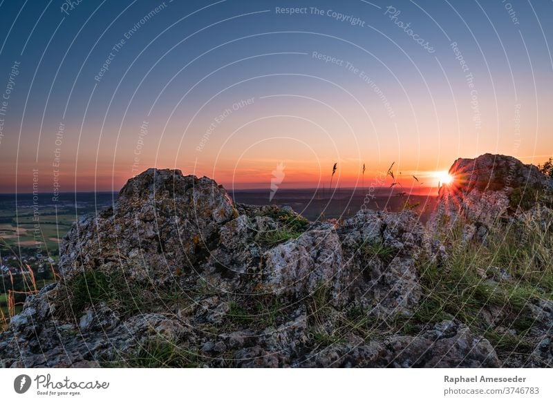 Sunset on mountain Walberla in Franconian Switzerland franconian switzerland landscape cliff colorful sunset sky walberla dusk rock beautiful beauty blue bright