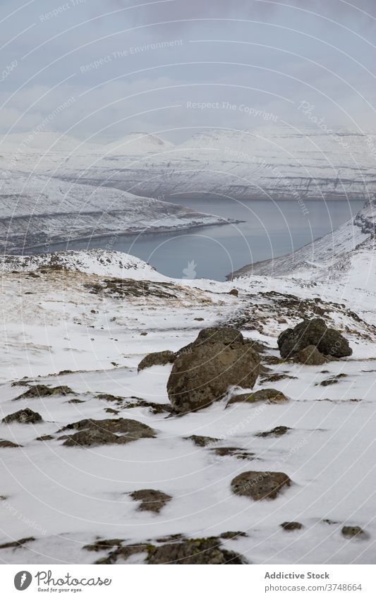 Amazing view of mountains on Faroe Islands river snow winter landscape spectacular cloudy season cold range faroe islands overcast sky ridge nature rock shore