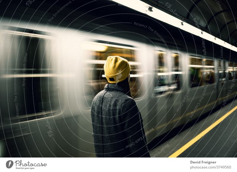 https://www.photocase.com/photos/3749560-young-woman-waits-at-the-metro-station-while-the-train-arrives-dot-photocase-stock-photo-large.jpeg