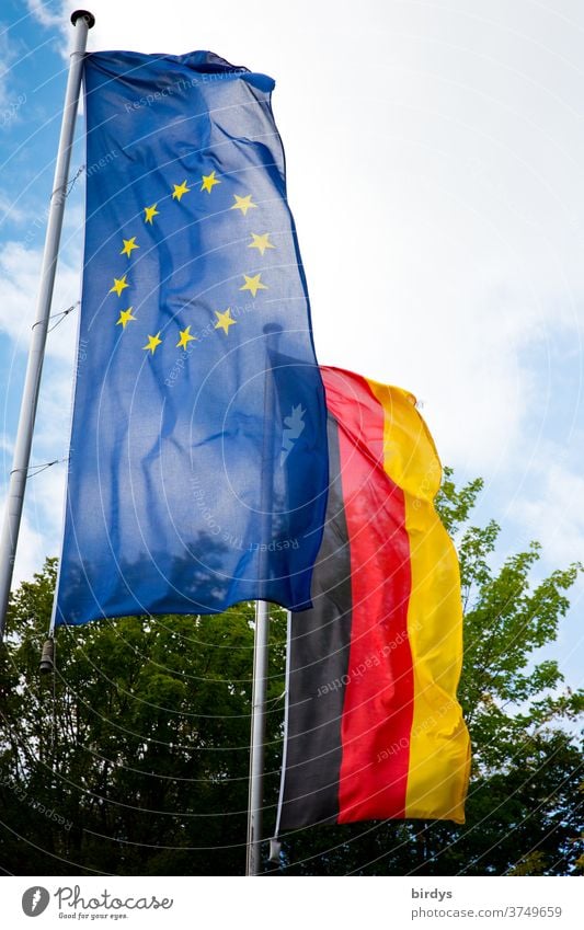 European flag and German flag are waving side by side in the wind. Europe, Germany, flags, EU, European Union Flags brd EU Flag Politics and state Blue stars