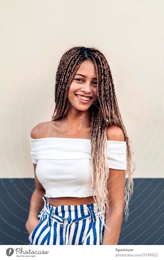 Portrait Girl With Braids portrait girl african girl wall looking at camera pretty background one person front view african american braids street attractive