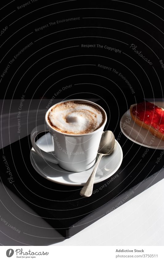 Cup of coffee with white froth on table milk black background traditional coffee shop continental black and white energy toast italian bakery blend daily