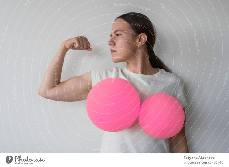 Woman with balloons on her breasts awareness cancer health pink female woman support care symbol disease charity help illness hope healthcare medicine campaign