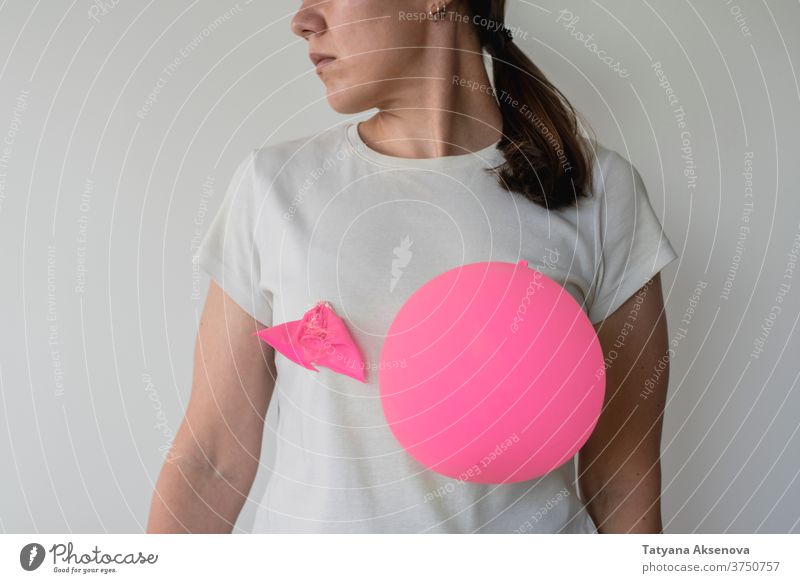 Woman with balloons on her breasts awareness cancer health pink female woman support care symbol disease charity help illness hope healthcare medicine campaign