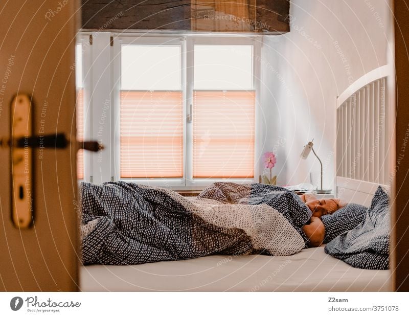 Young woman in bed with the Smarphone Bed at home Relaxation relaxation dwell Cozy Window Light Old building Blonde long hairs pretty Lie Cellphone smarphone