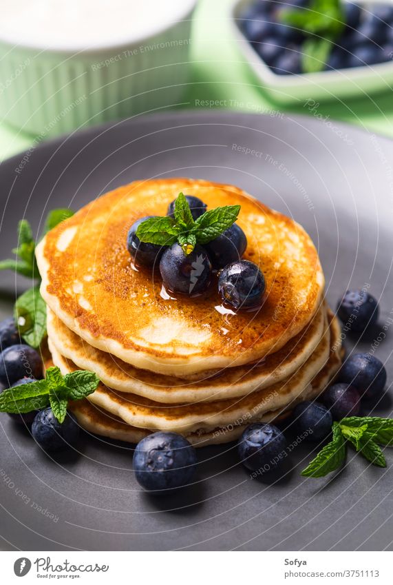 Home made pancakes served with fresh berries american breakfast food blueberry beautiful cooked culinary delicious dessert fluffy fried brunch healthy homemade