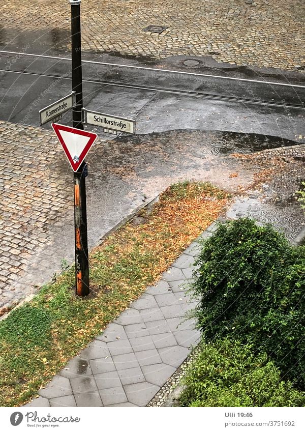 The rainwater simply does not run off! (1) cross right of way sign Priority road Puddle Deluge Water Rainwater Reflection Wet Street Weather Deserted