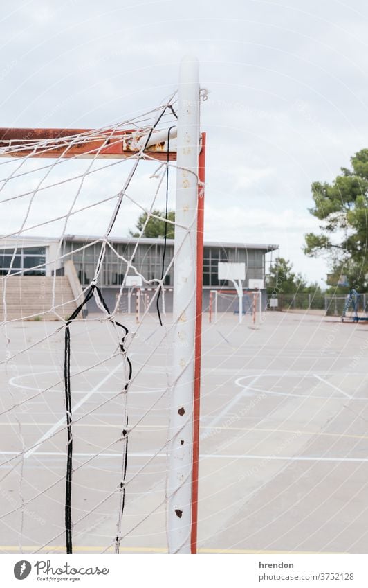 an empty school yard soccer goal net education back to school elementary primary educational no people elementary school playground sport game football nobody