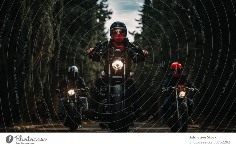 Bikers on motorcycles driving on country road biker motorbike ride drive group speed power fast travel freedom route transport adventure vehicle journey motion