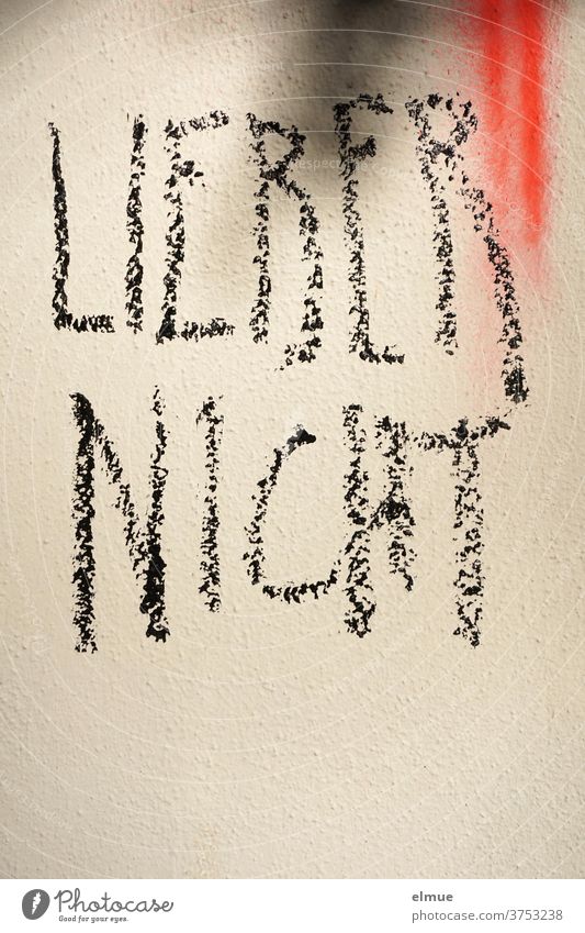 "LOVER NOT" is written in big block letters in black on the wall rather not Daub opinion formation Cancelation Clue Wall (building) Decide Warn Fear advice