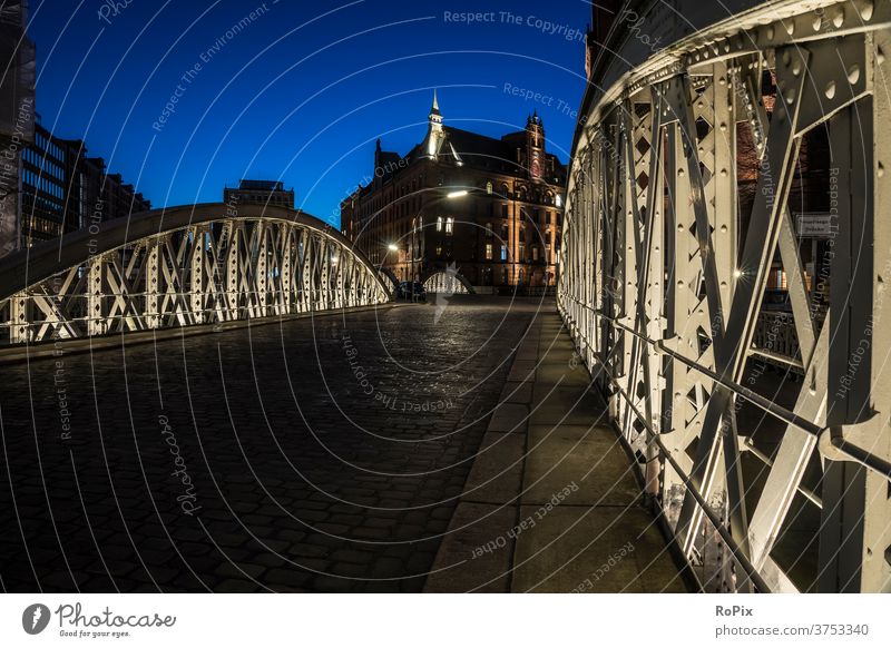 Historical bridge in the Speicherstadt of Hamburg. storehouse city Harbour Depot Channel urban Elbe built Architecture River Night Light Low tide canal locks
