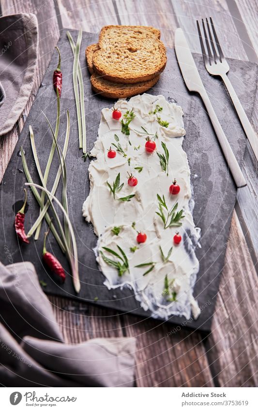 Delicious dish with herbs on slate board cream cheese bread delicious gourmet meal fresh cuisine snack rustic various wooden table food slice natural assorted