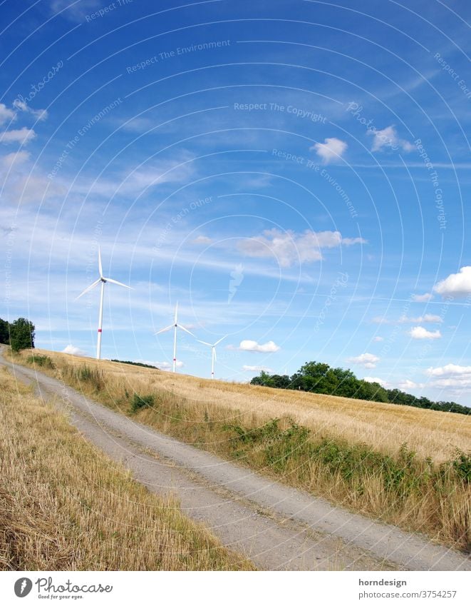 Wind power plants in nature Pinwheel windmills wind power Wind energy plant Renewable energy Energy industry Sky Colour photo electricity