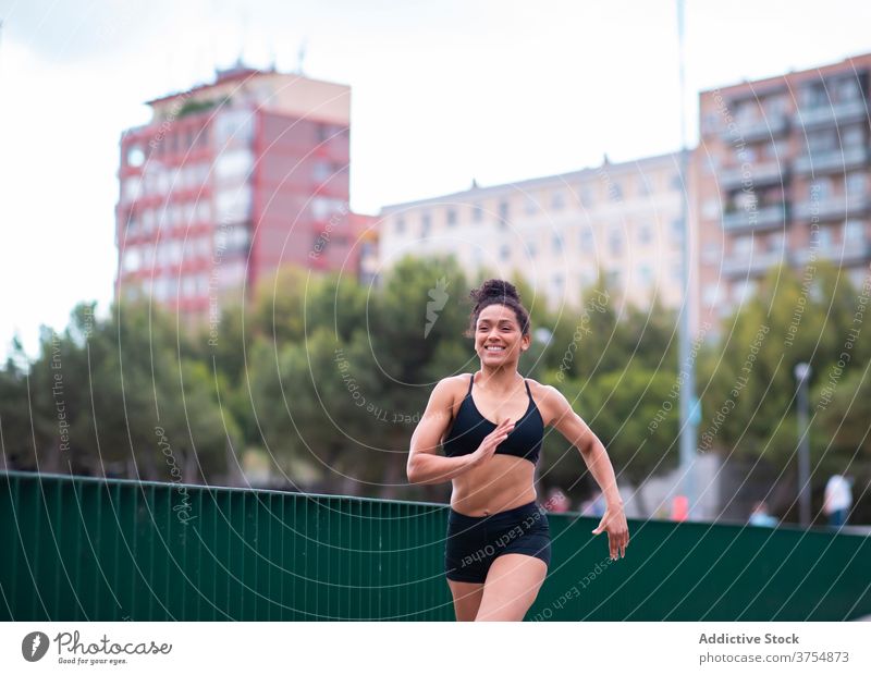 Premium Photo  Athlete young fitness woman runner in black sportswear  jogging exercise on a treadmill rubber stadium on sunny summer day