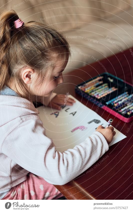 Little pre-school girl learns to solve puzzles online and plays educational  games on tablet at home - a Royalty Free Stock Photo from Photocase