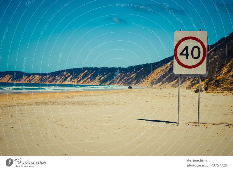 Maximum speed - 40 km - on a stretch of beach . On the left the blue sea and on the right a high bank. In the distance on the beach you can see a car. coast