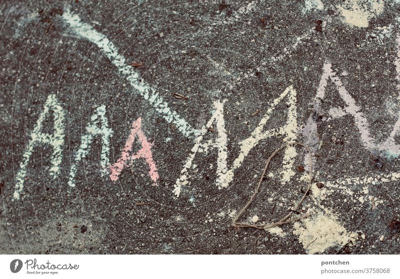 The letter A is written with chalk on asphalt. Start of school, A-doctor's appointment learn to write start of school street chalk Write Child Characters