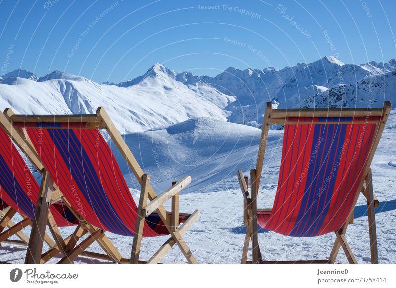 three deckchairs red-blue in a winter landscape Deckchair Red Blue Striped Winter Winter vacation Winter mood Snow Colour photo Exterior shot Snowscape Nature