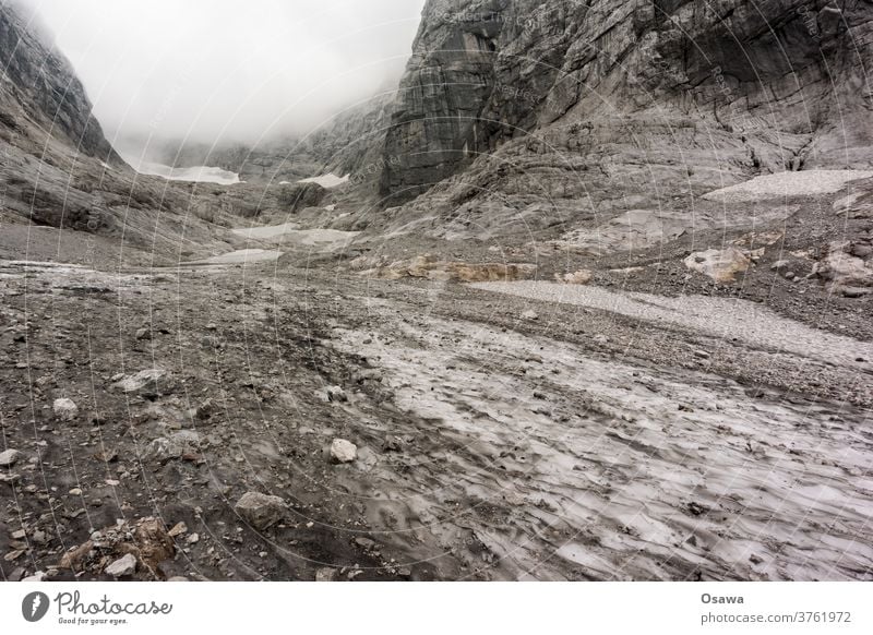 The remains of the blue ice glacier Mountain mountains Alps Blue ice glacier Ice Stone Gravel Snow Rock Landscape Exterior shot Cold Glacier Climate Environment