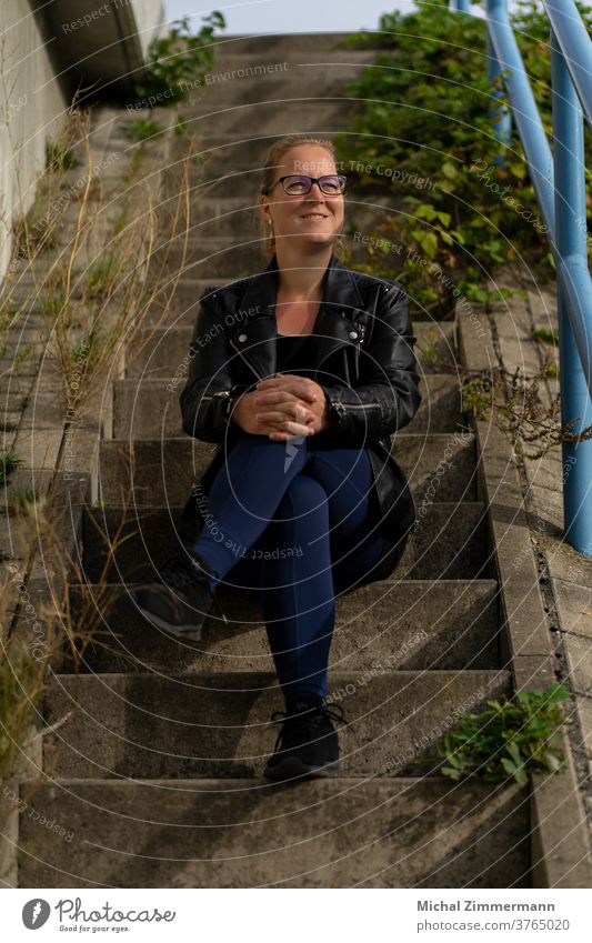 Woman on stairs Face of a woman Stairs Young woman portrait 18 - 30 years Human being Feminine Youth (Young adults) Adults Colour photo Women's eyes