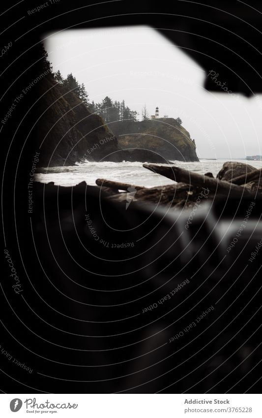 Car parked near rocky ocean coast coat rough stormy car cold overcast shore sea wave gray wild gloomy nature weather usa united states america pacific travel