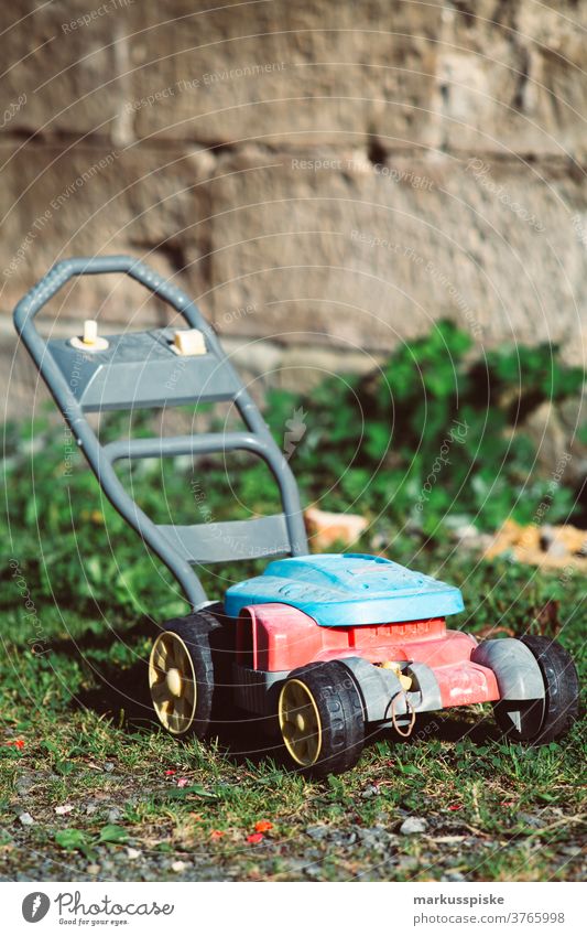 Kids Lawn Mower Toy Toys - a Royalty Free Stock Photo from Photocase