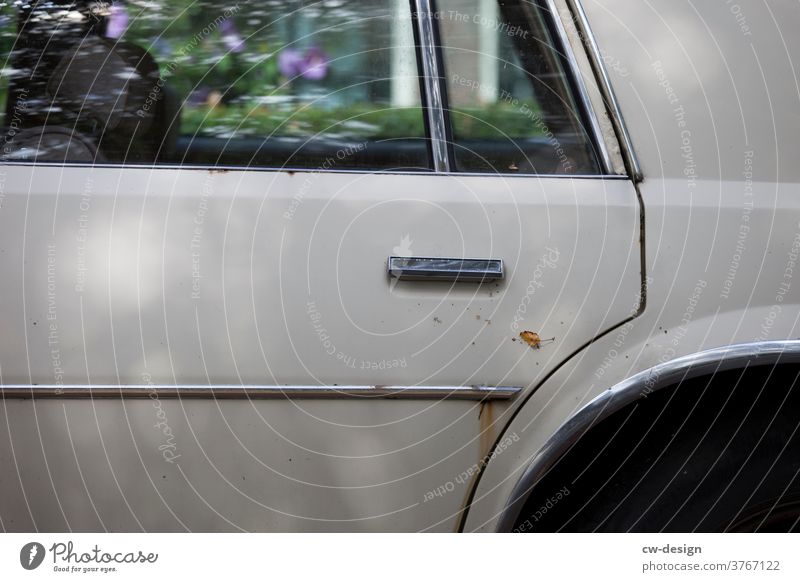 Detail of an old rusty car in side view Old Silver decorative stripes door Exterior shot Colour photo Vehicle Transport Street Vintage car Retro