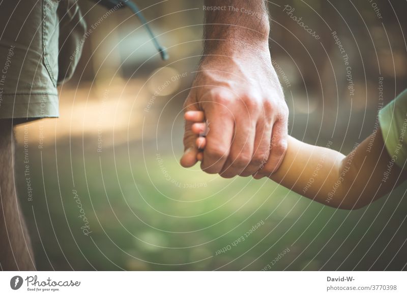 Helping hand - father and child hold hands Parents Considerate Child Love Safety (feeling of) Trust Father proximity Responsibility Emotions Together