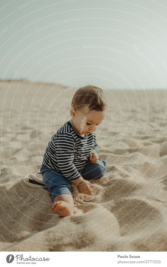 Toddler playing in the Sandy beach Child childhood Vacation & Travel Ocean nature Summer Childhood memory Exterior shot Infancy Beach Playing Lifestyle Cute