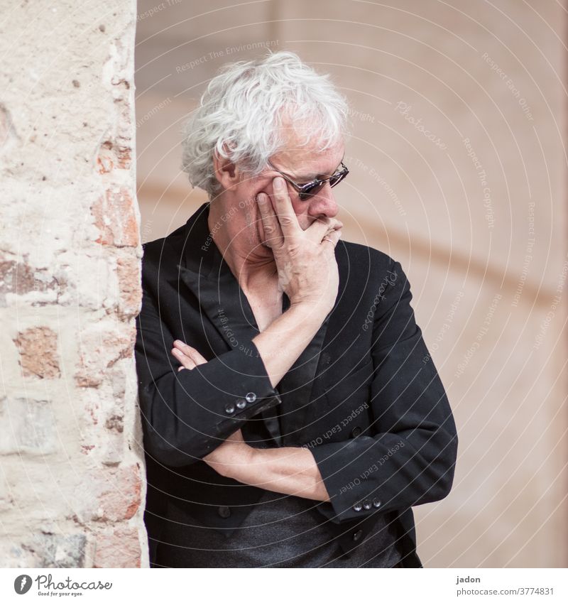 ...in thought. Man Only one man portrait Individual black tailcoat Gray-haired Sunglasses Wall (building) Wall (barrier) piers Ajar arms crossed Hand on face