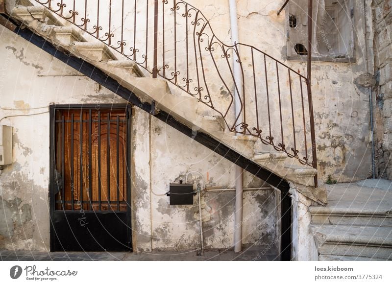 Tyre, Lebanon - October 8 2015: Traditional stair entrance with broken handle of Lebanese house in Tyre, Lebanon Middle East Arabic architecture exterior old