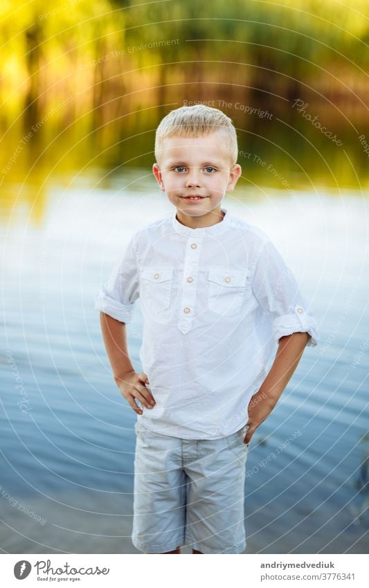 Blonde Baby Boy In Jeans And A Cowboy Hat Stock Photo - Download