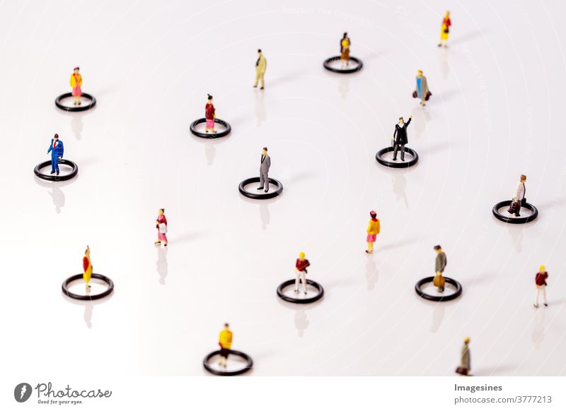 Social dissociation. Miniature toy people in circles keeping distance in public social problems Dissociation covid-19 Teamwork Concepts reduction coronavirus