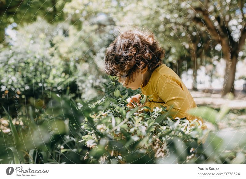 Child playing in the garden Children's game childhood Garden Playing 1 - 3 years Caucasian colorful Infancy Happiness Leisure and hobbies Colour photo