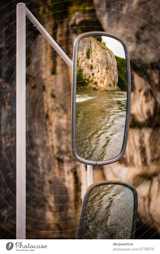 Rear-view mirror on a ship, at the Danube narrows near Weltenburg. You can see water and rocks. Rear view mirror Driving Colour photo Vacation & Travel