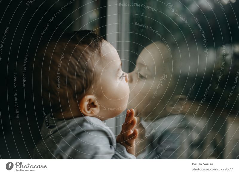 Toddler kissing glass window Reflection Window Glass Child Caucasian Kissing Boy (child) Colour photo Infancy Human being Joy Day Interior shot Cute Small