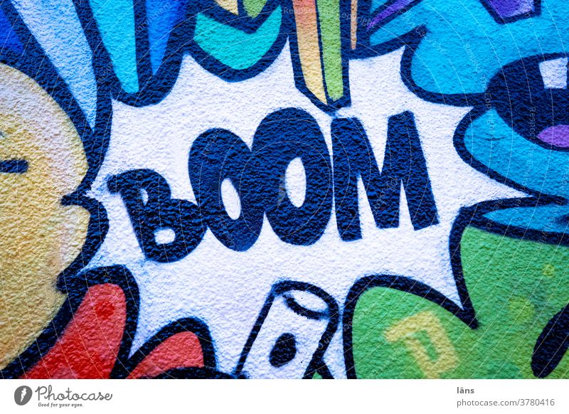 BOOM l Explosion boom Graffiti House (Residential Structure) built Wall (building) Facade Exterior shot Characters Deserted Wall (barrier) Town Colour photo
