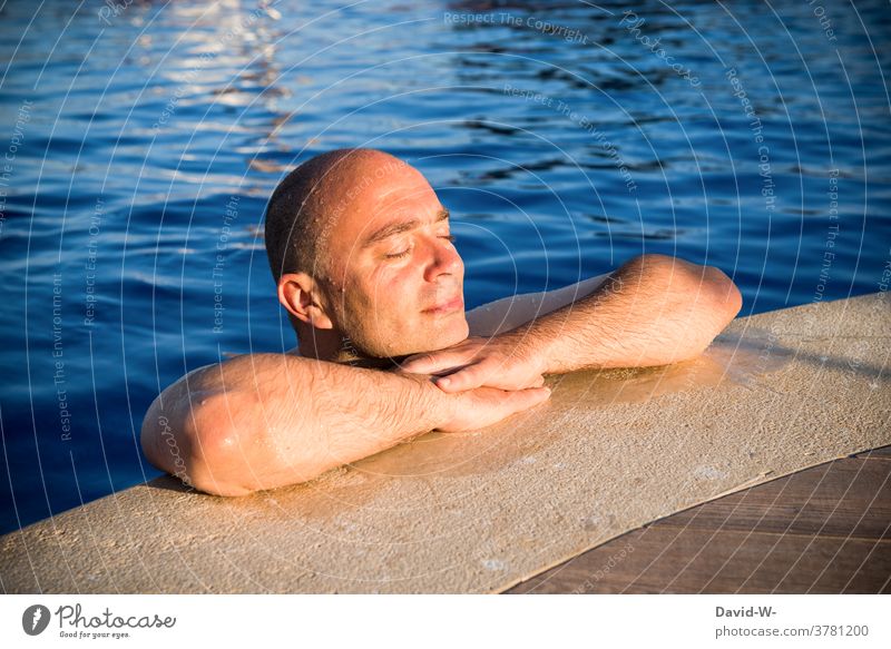 Sunbathing - man lets the sun shine on him in the pool sunny Man To enjoy vacation Wellness Sunbeam tranquillity Relaxation